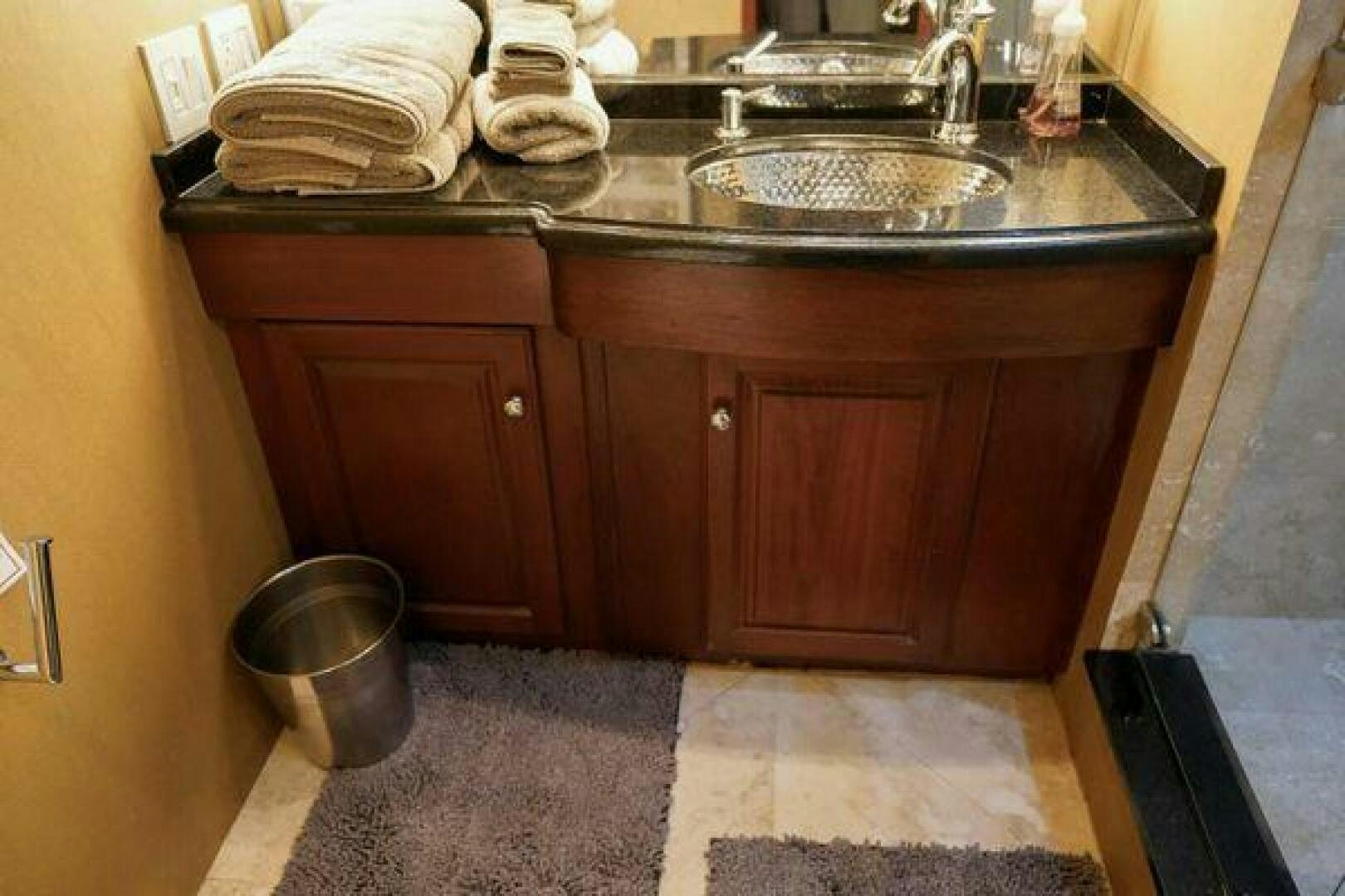 a kitchen counter with towels aboard POLE POSITION Yacht for Sale