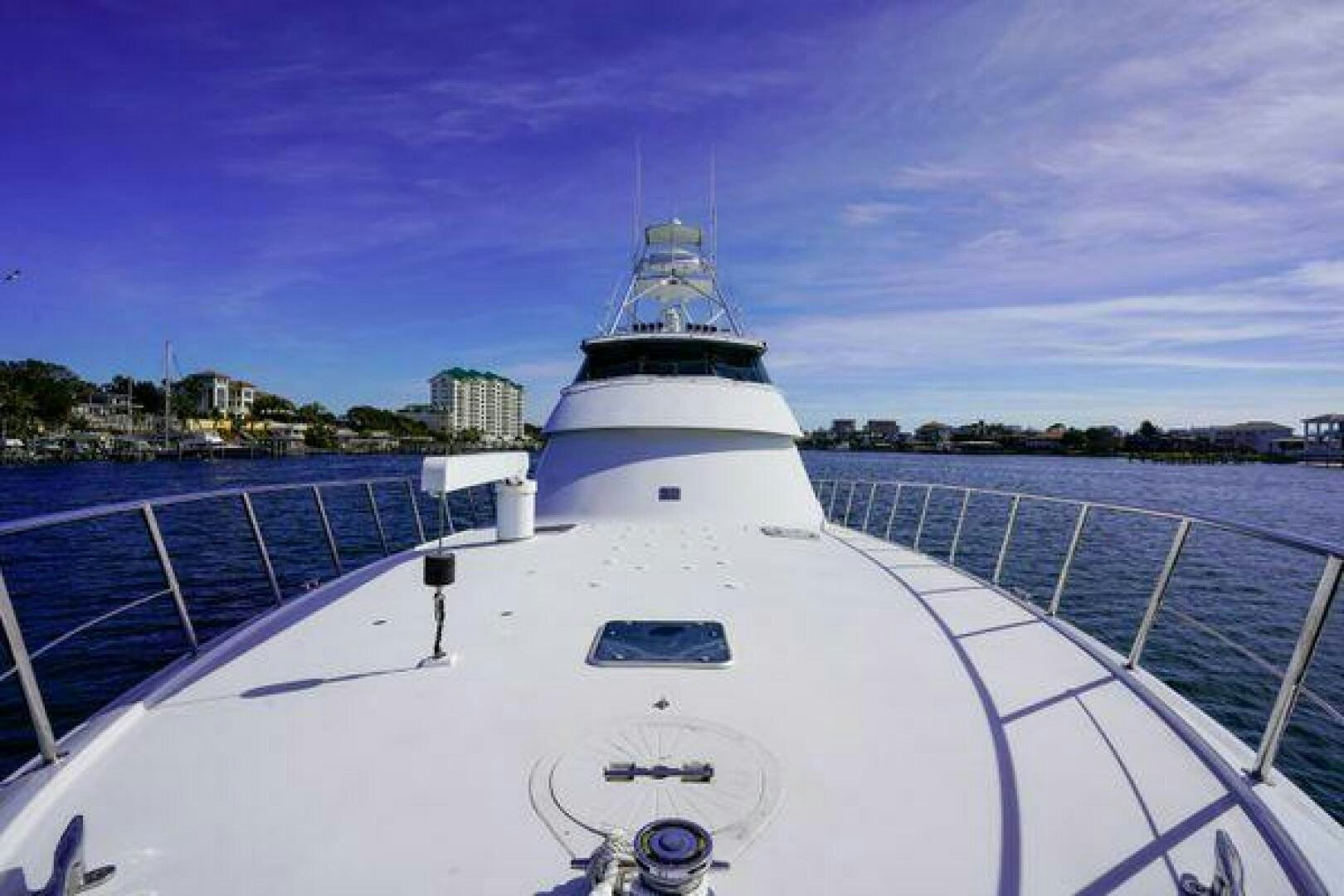 a white yacht on a dock aboard POLE POSITION Yacht for Sale