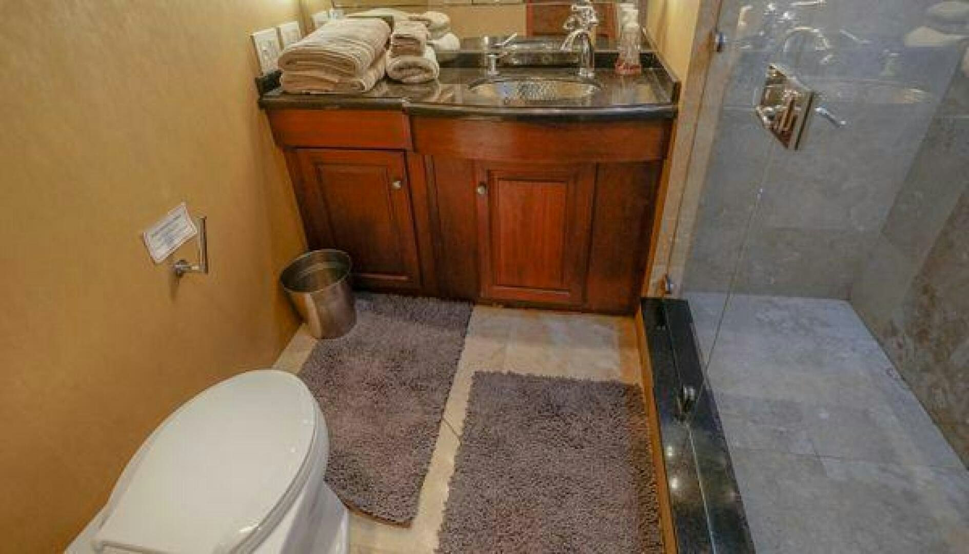 a bathroom with a sink and a toilet aboard POLE POSITION Yacht for Sale