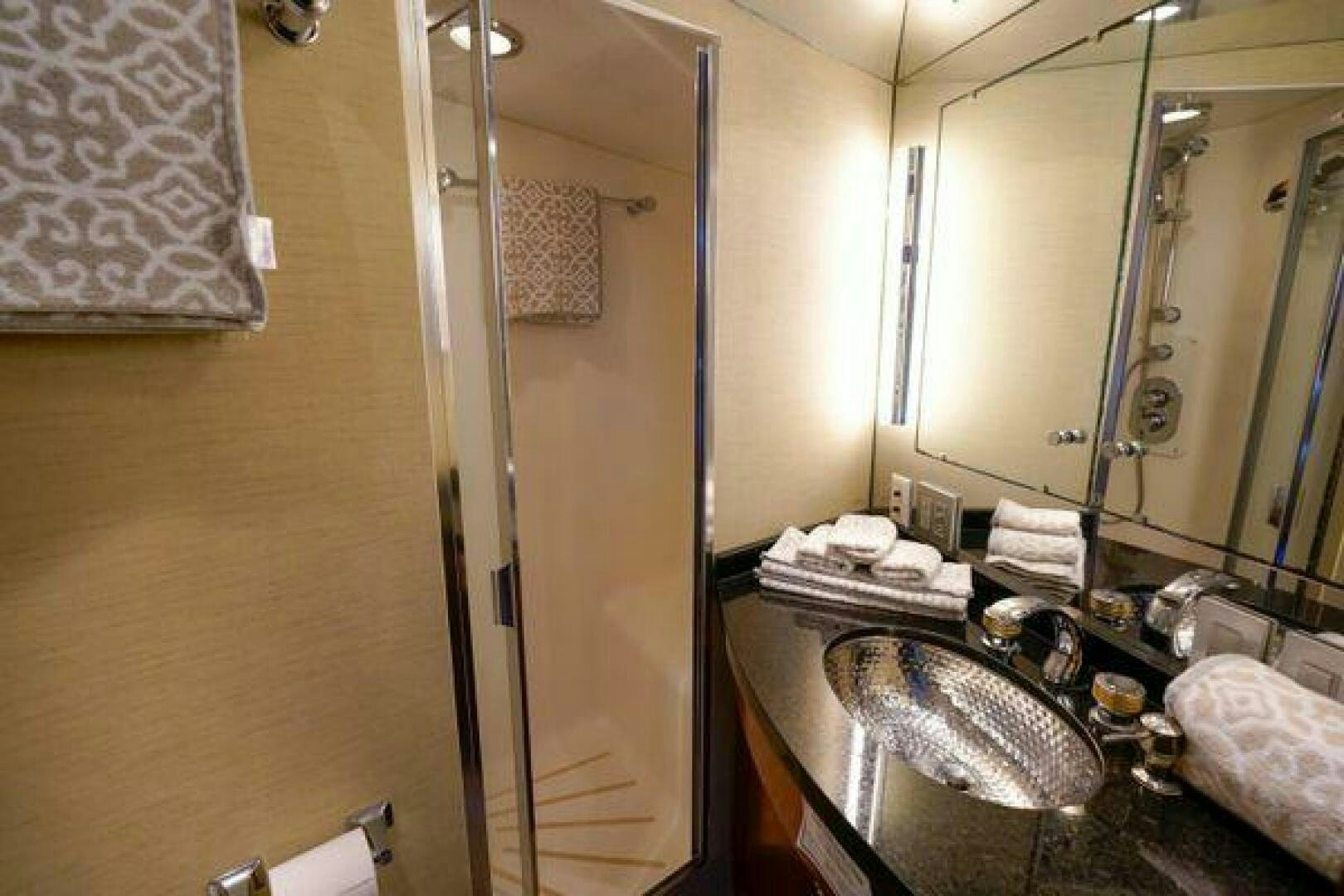 a bathroom with a large mirror aboard POLE POSITION Yacht for Sale