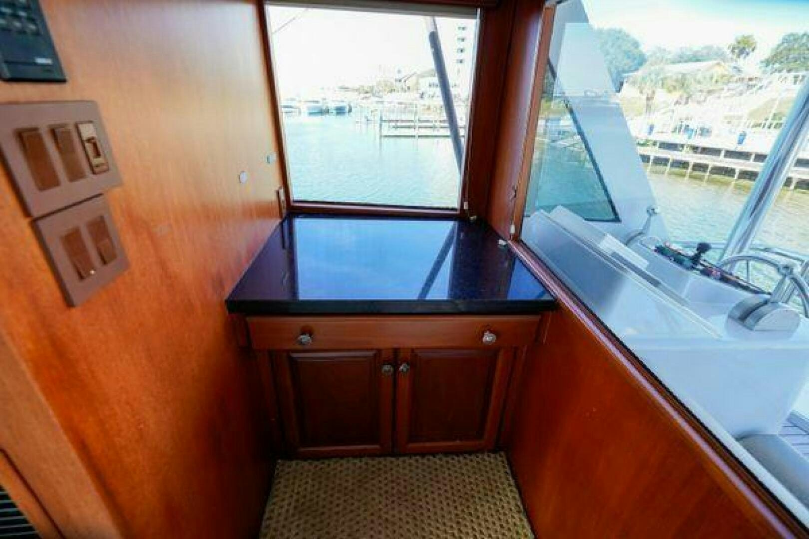 a kitchen with a sink and a window aboard POLE POSITION Yacht for Sale