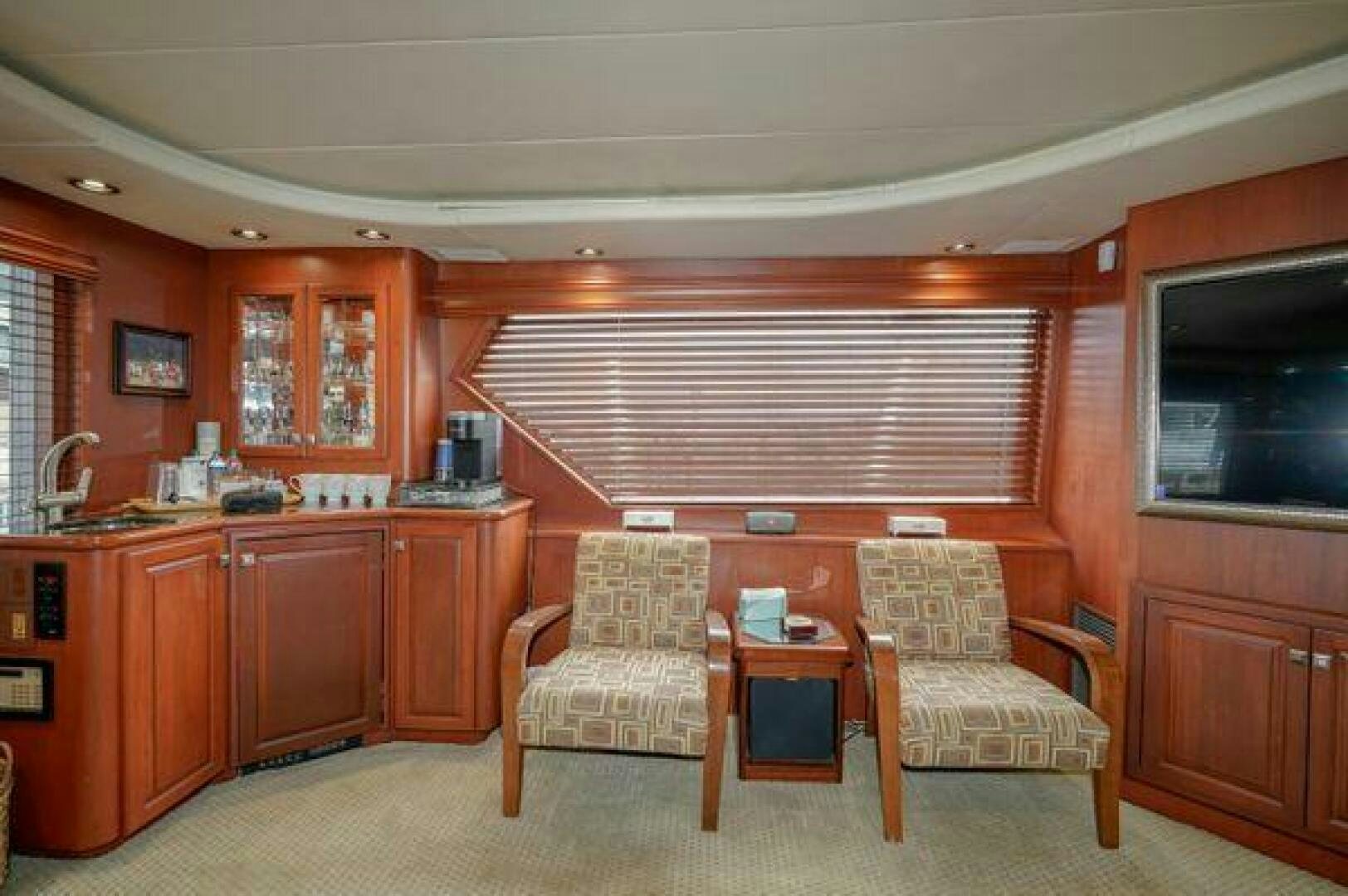 a living room with a couch and chairs aboard POLE POSITION Yacht for Sale