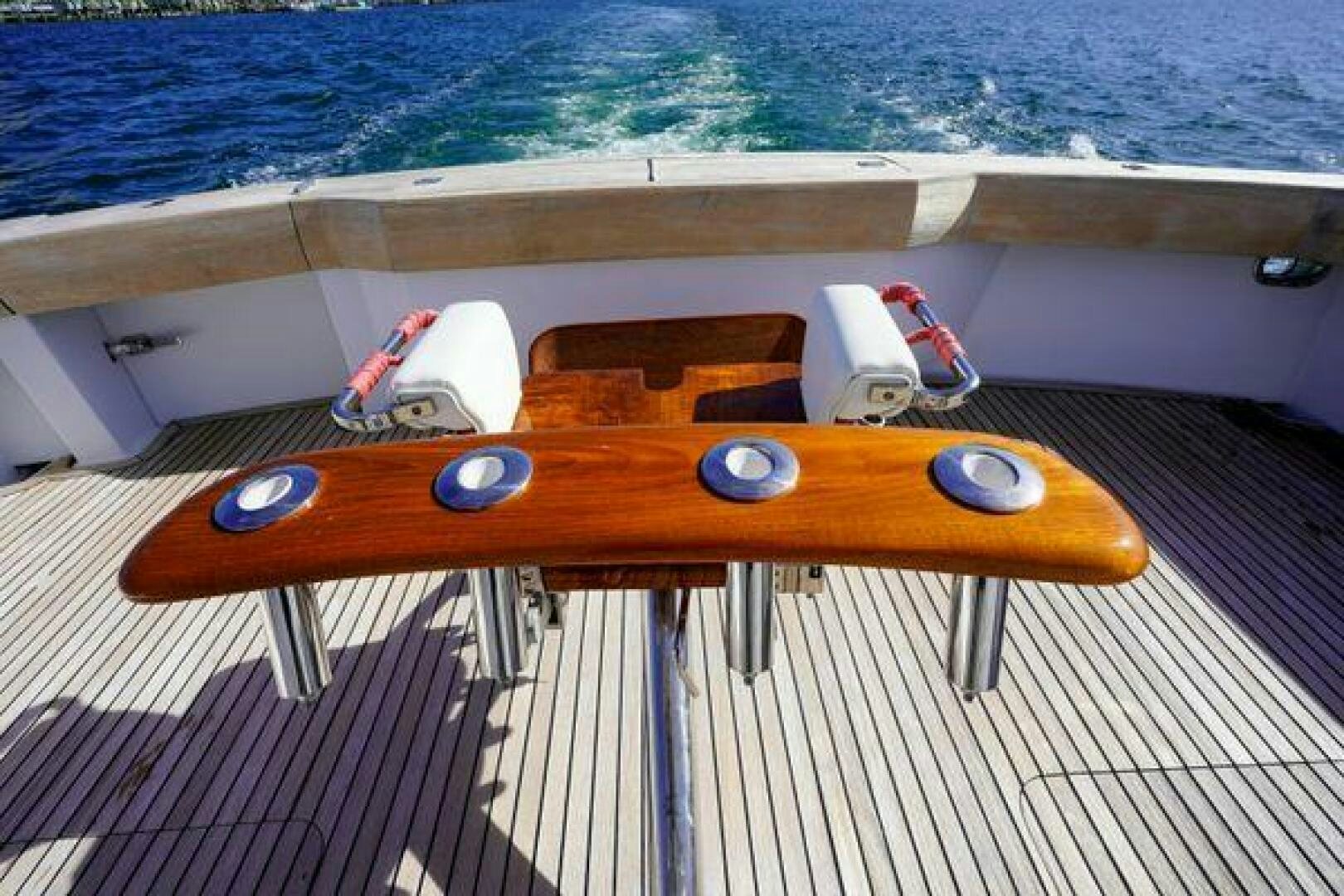 a surfboard on a deck aboard POLE POSITION Yacht for Sale