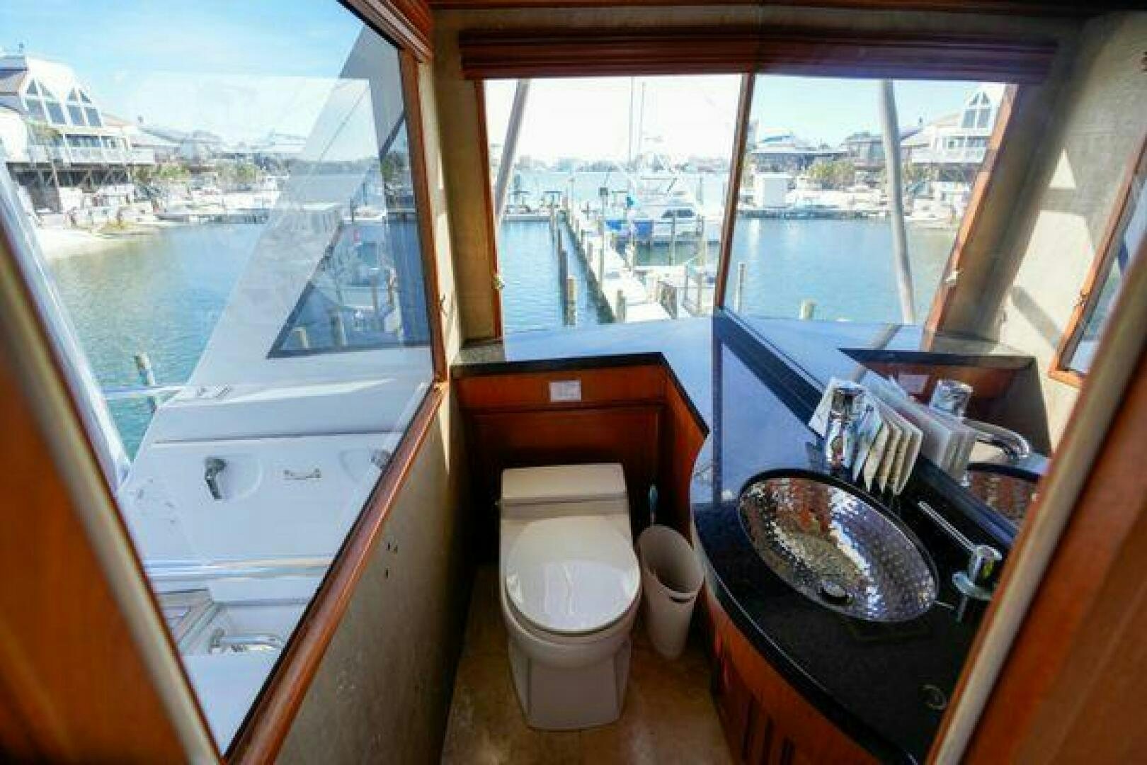 a bathroom with a sink and toilet aboard POLE POSITION Yacht for Sale
