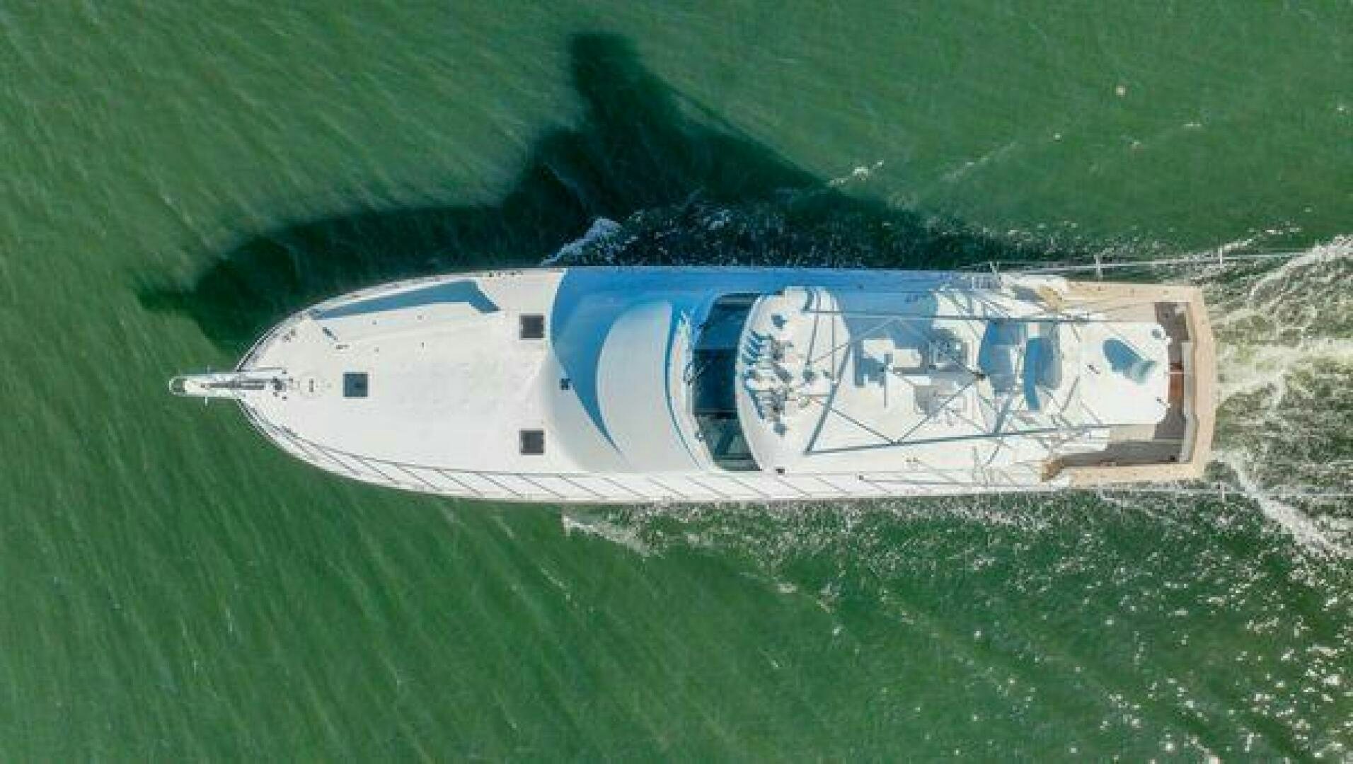 a helicopter flying over a field aboard POLE POSITION Yacht for Sale