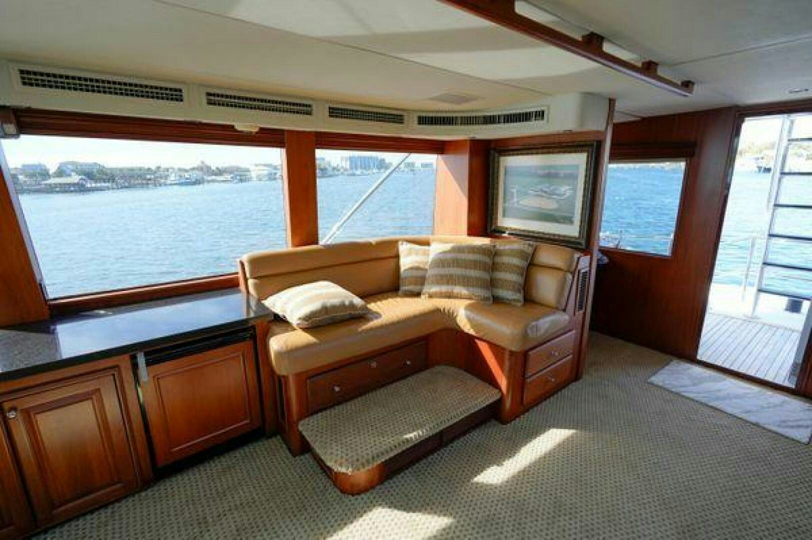 a room with a bed and a couch aboard POLE POSITION Yacht for Sale