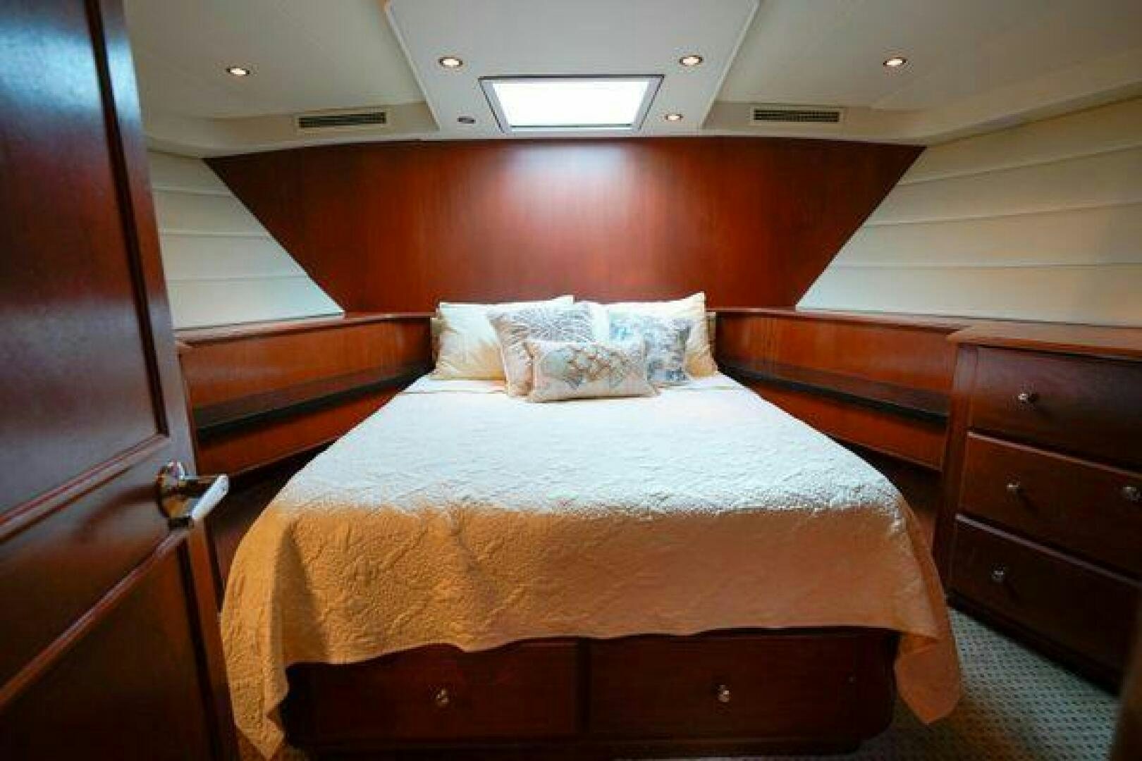 a bed with white sheets aboard POLE POSITION Yacht for Sale