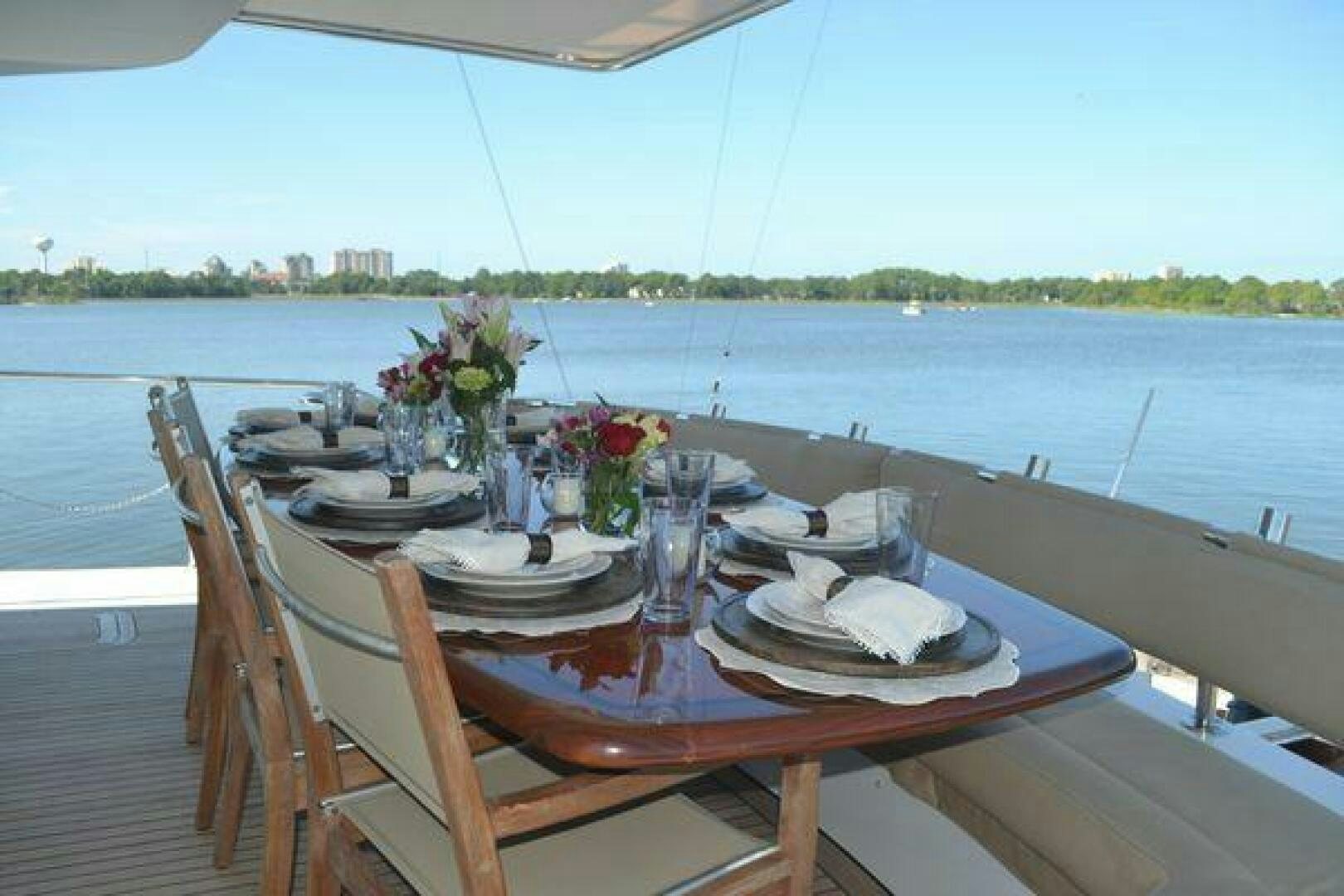 a table set with food on it aboard POLE POSITION Yacht for Sale