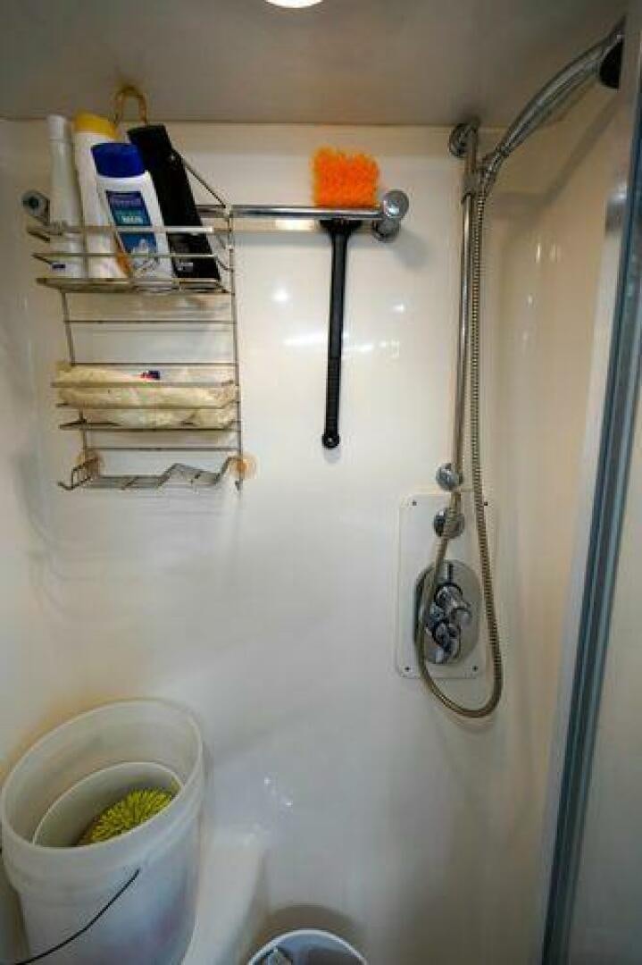 a shower with a sink and a faucet aboard POLE POSITION Yacht for Sale