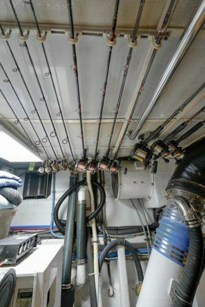 a large white tent with many pipes aboard POLE POSITION Yacht for Sale