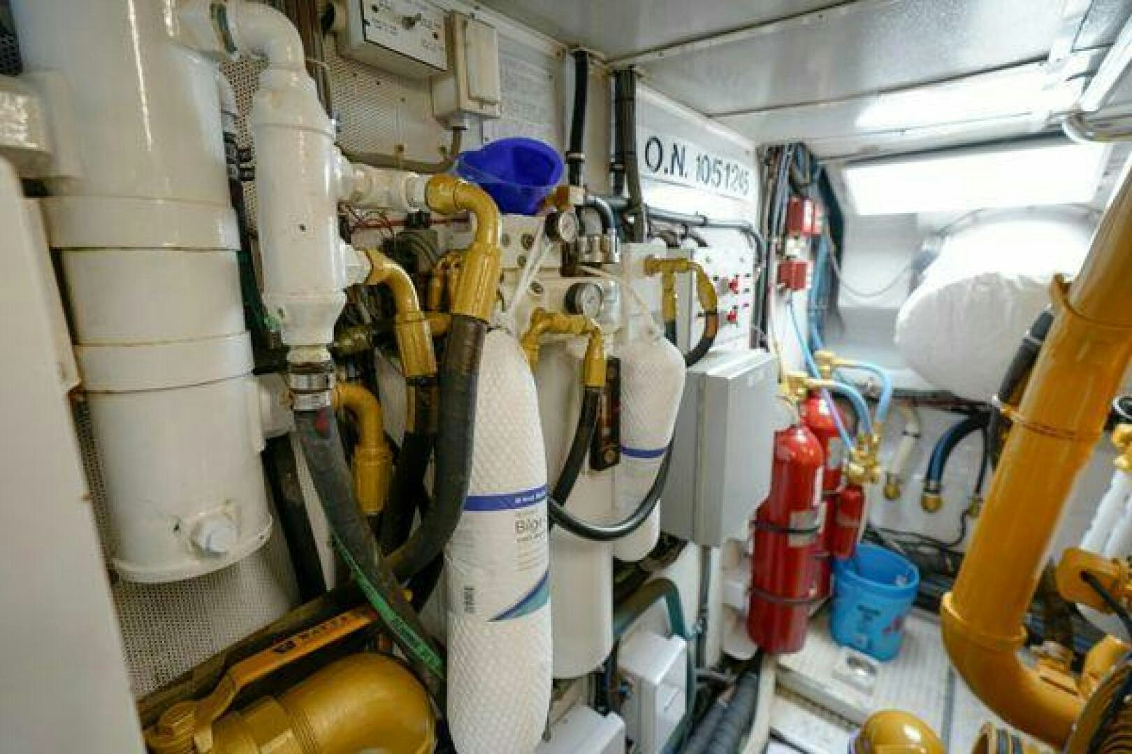 a room with several white and yellow pipes aboard POLE POSITION Yacht for Sale