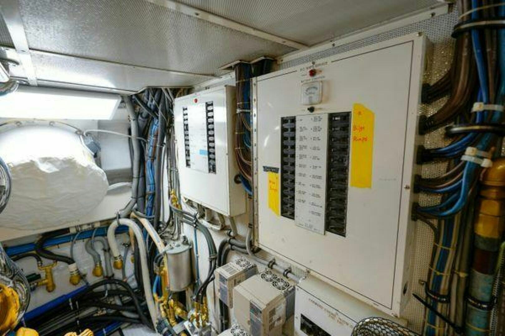 a white board with wires and a white board aboard POLE POSITION Yacht for Sale