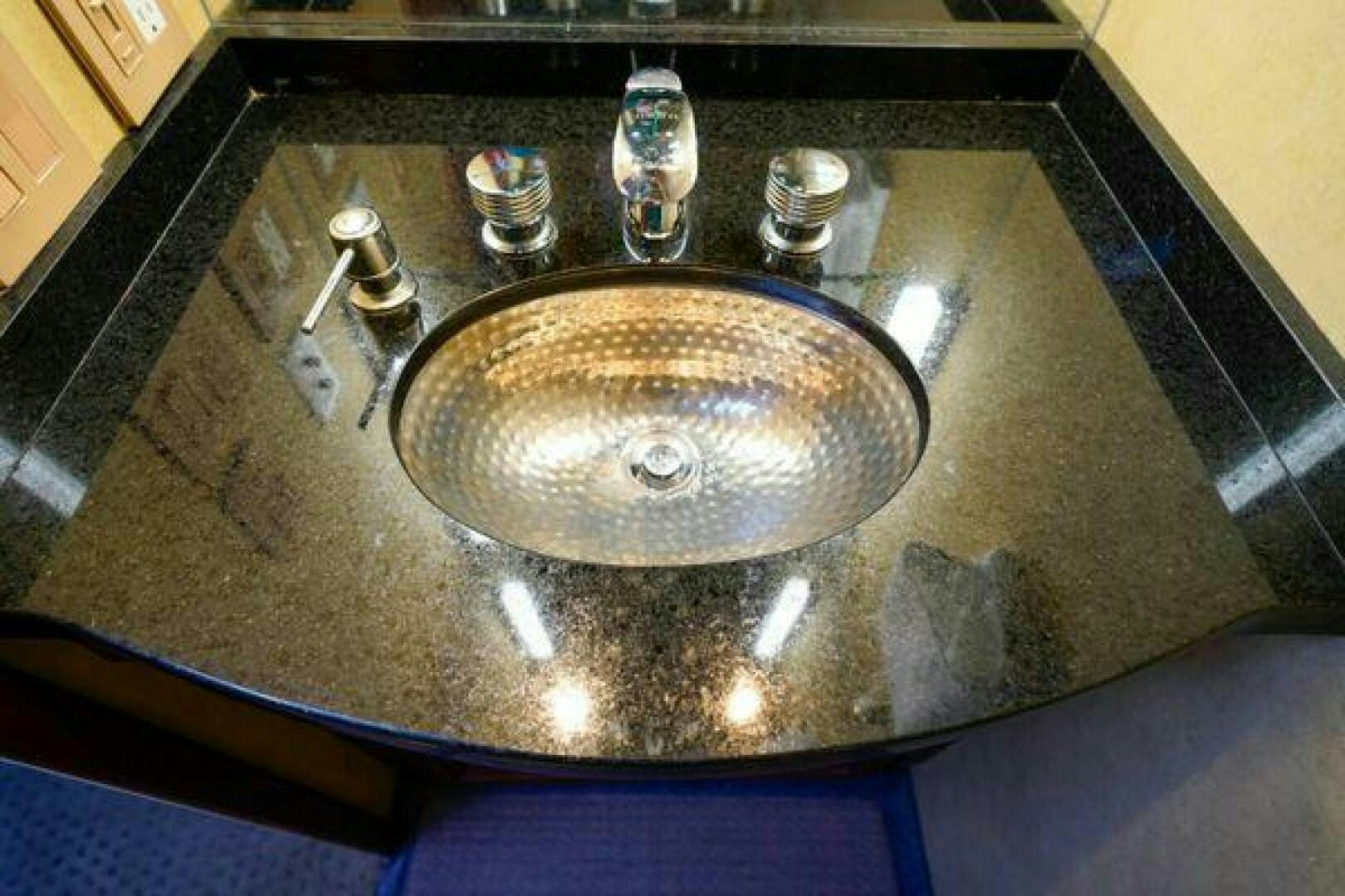 a sink with a faucet aboard POLE POSITION Yacht for Sale