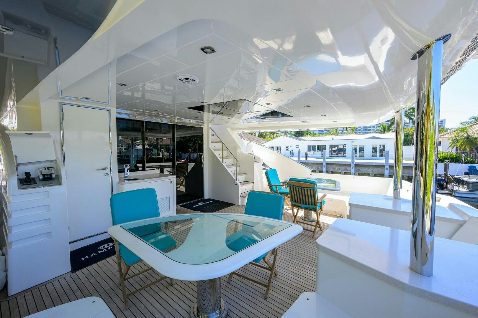 a room with a pool table and chairs aboard FUJIMO Yacht for Sale