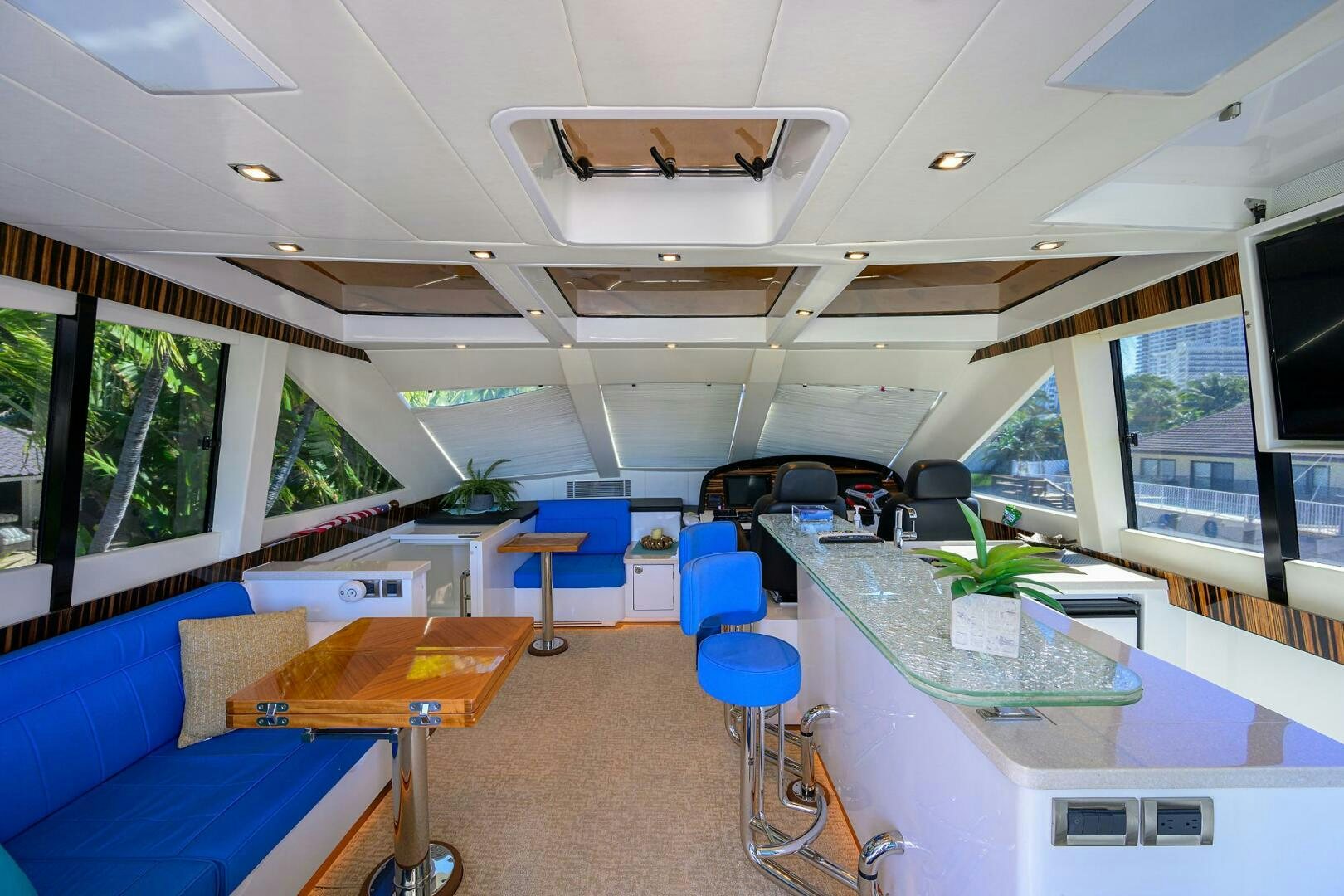 a room with a table chairs and a window aboard FUJIMO Yacht for Sale
