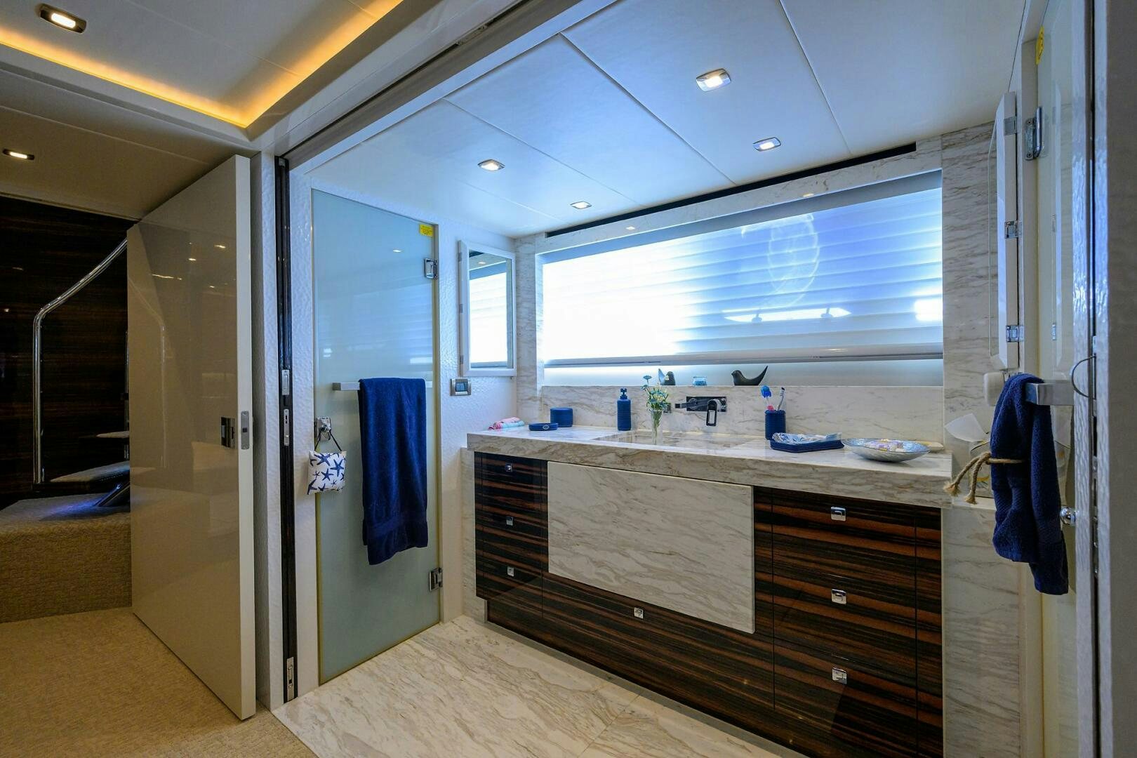 a bathroom with a countertop sink and cabinets aboard FUJIMO Yacht for Sale