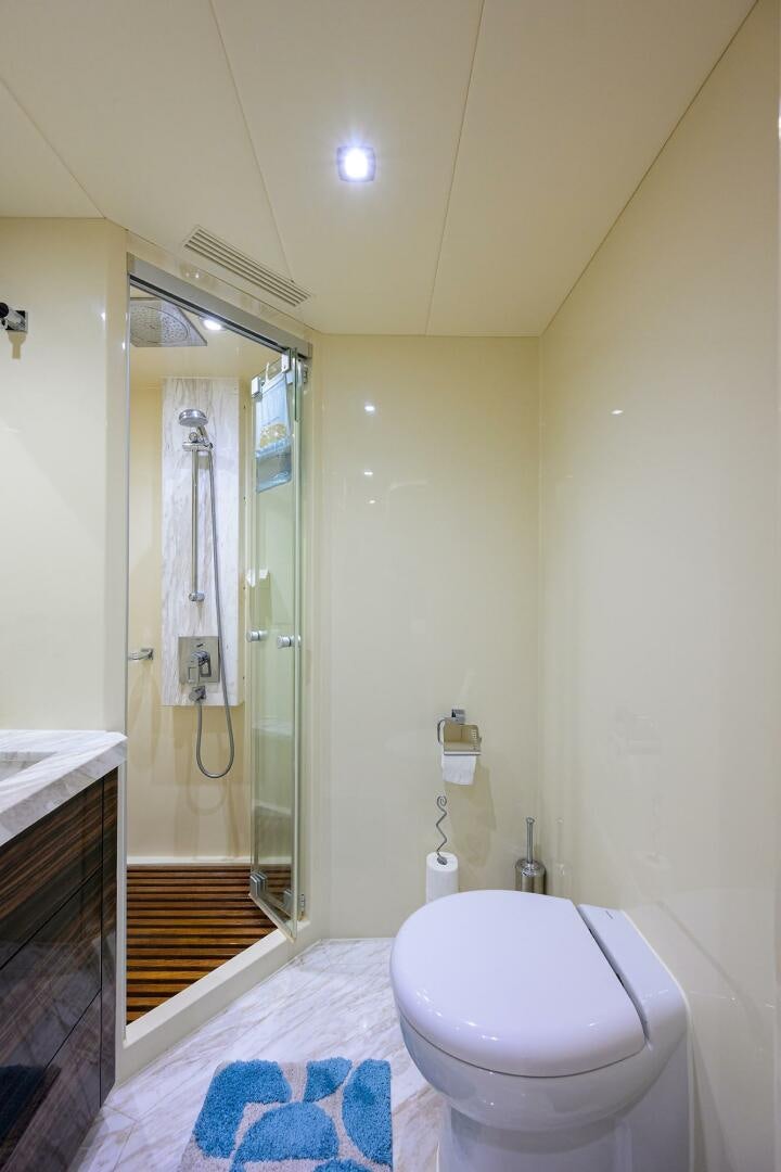 a bathroom with a shower unit and a toilet aboard FUJIMO Yacht for Sale