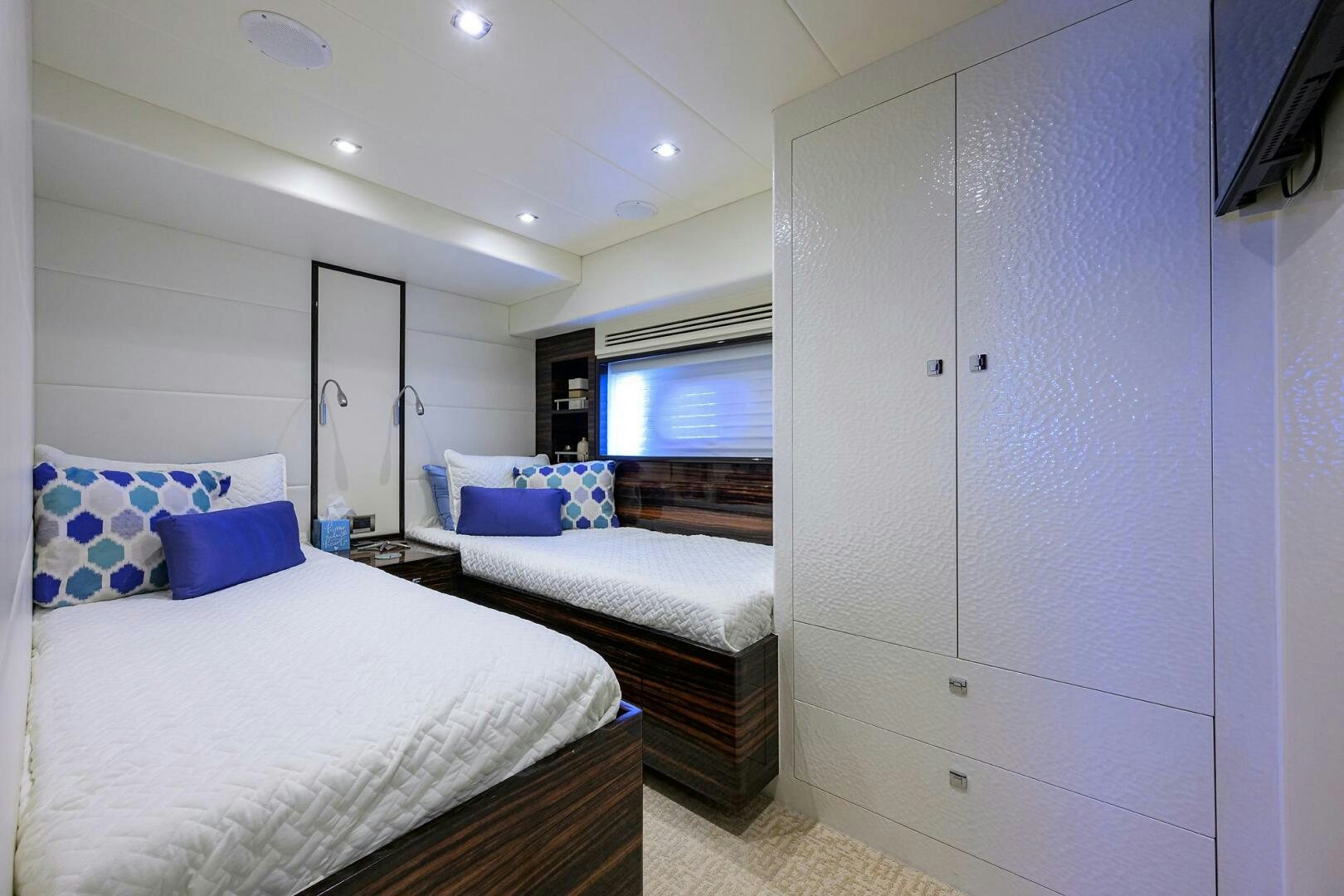 a room with a bed and a closet aboard FUJIMO Yacht for Sale