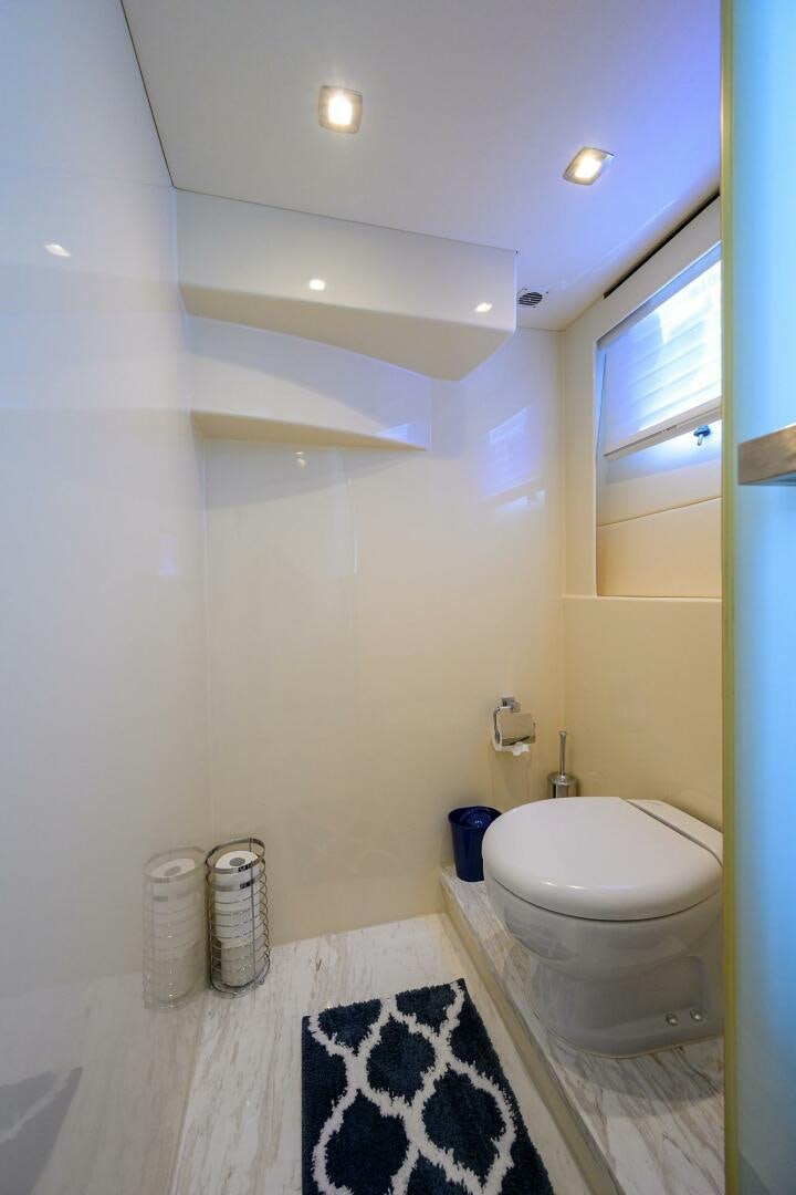 a bathroom with a toilet and a sink aboard FUJIMO Yacht for Sale