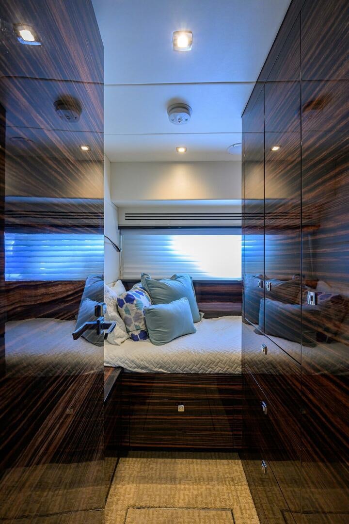 a bed in a room aboard FUJIMO Yacht for Sale