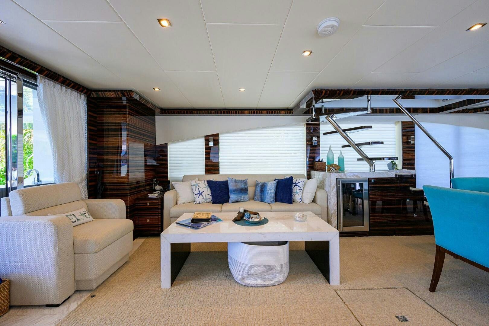 a living room with a couch and a table aboard FUJIMO Yacht for Sale