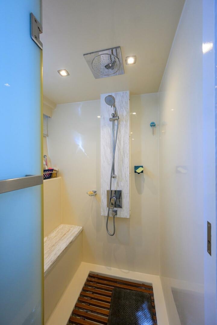 a shower with a towel from the ceiling aboard FUJIMO Yacht for Sale