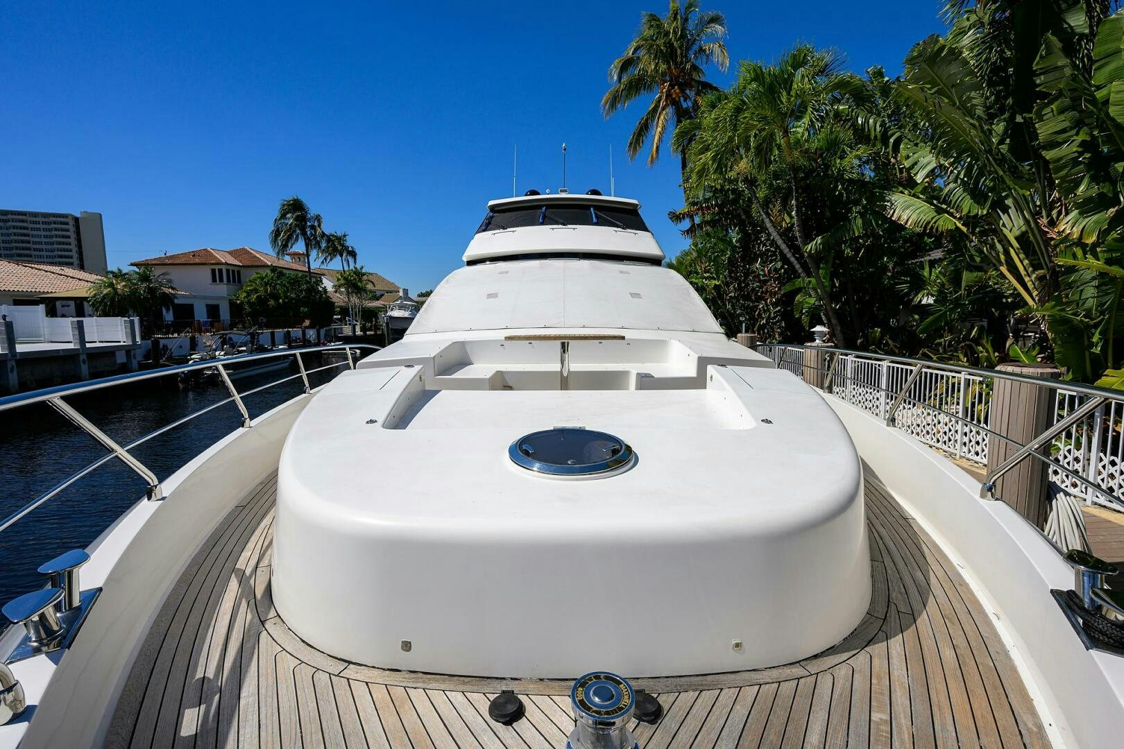 a white boat on a deck aboard FUJIMO Yacht for Sale