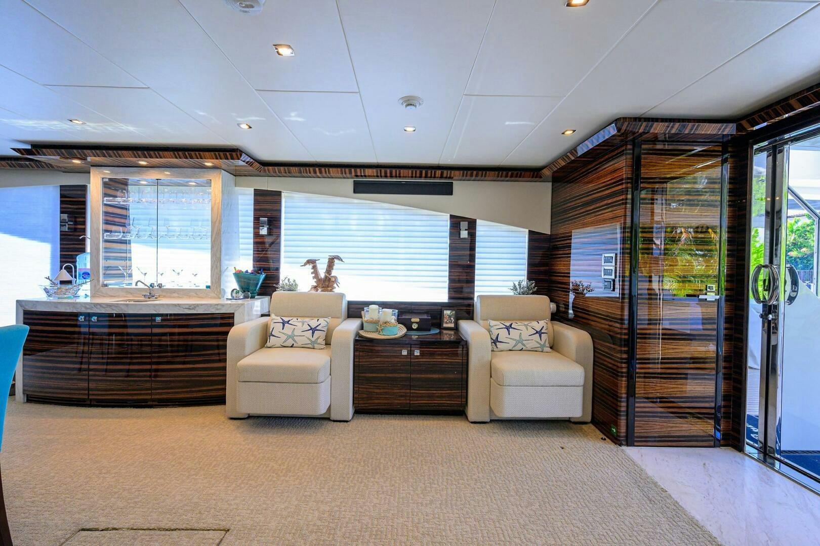 a large room with a couch and a large window aboard FUJIMO Yacht for Sale