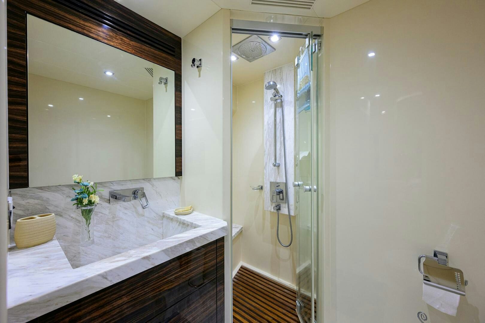 a bathroom with a large mirror aboard FUJIMO Yacht for Sale