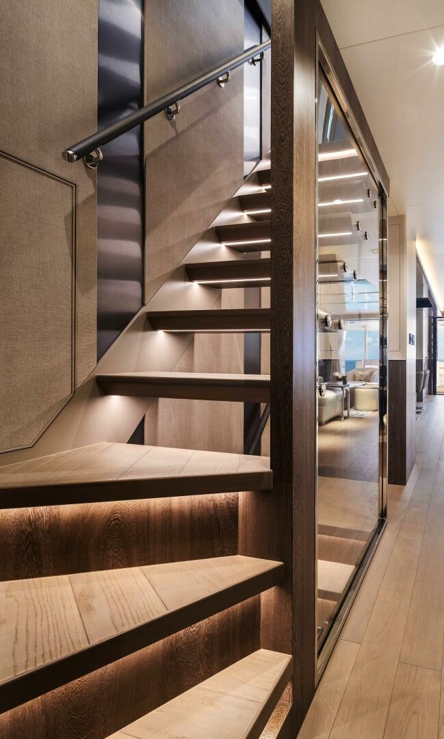 a staircase with a metal railing aboard FD80-614 Yacht for Sale
