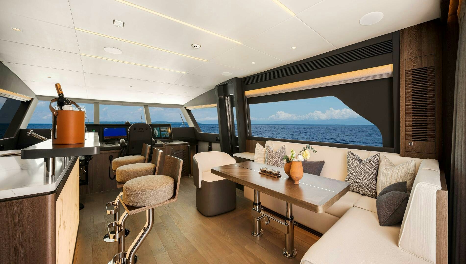 a room with a couch and a table and chairs aboard FD80-614 Yacht for Sale