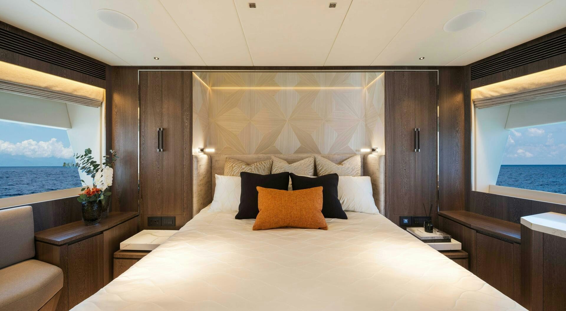 a bed with a white bed spread aboard FD80-614 Yacht for Sale
