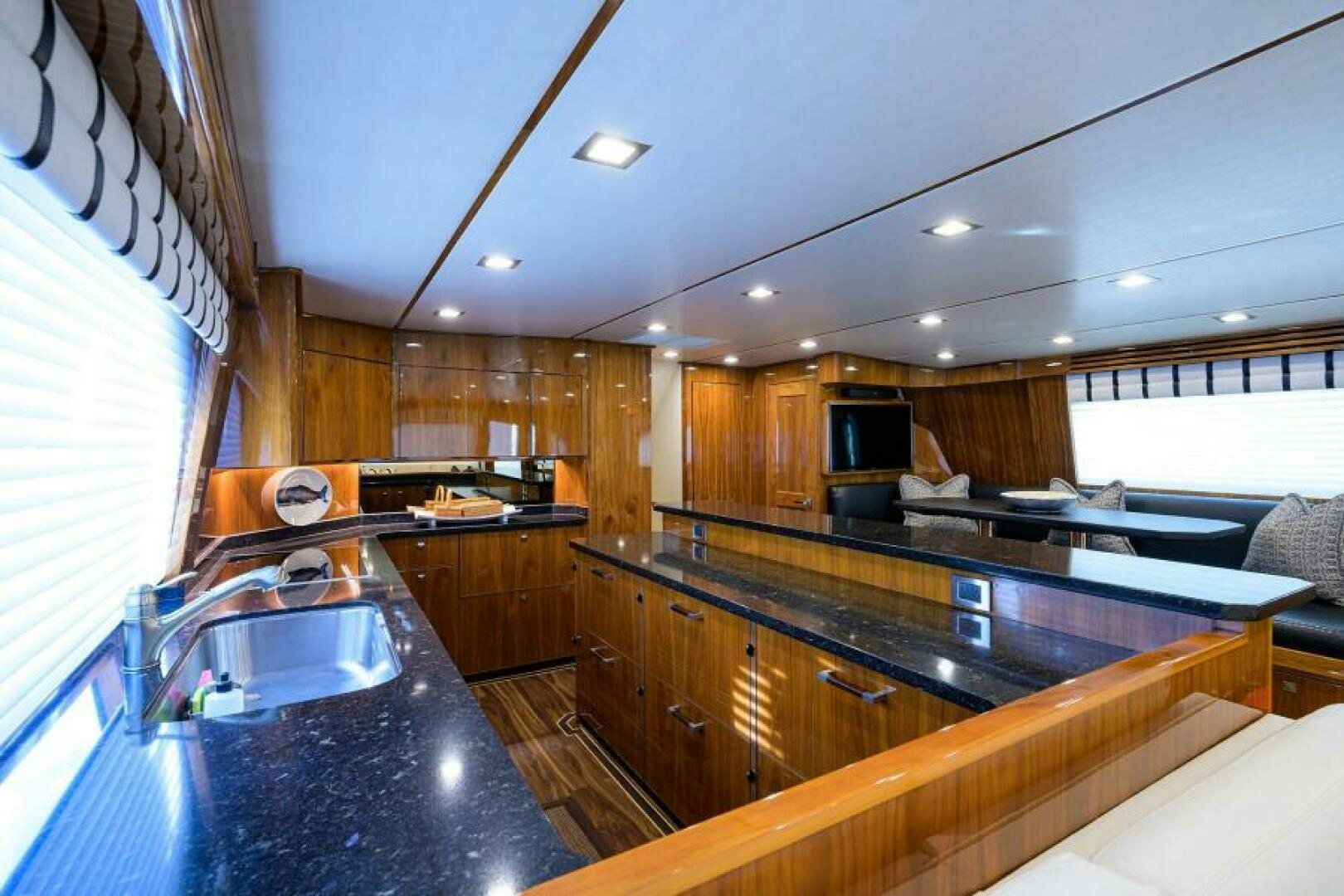 a kitchen with a large island aboard MIRAGE DELETE Yacht for Sale