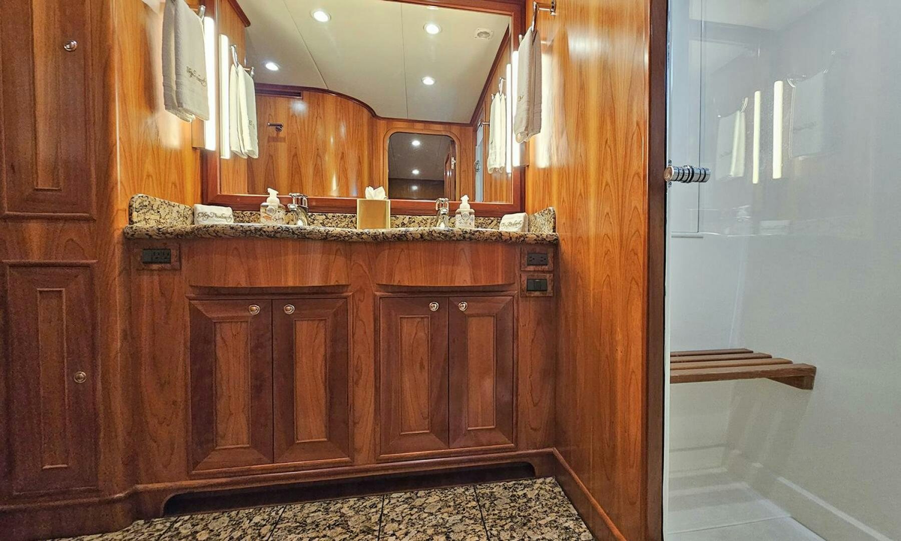 a kitchen with wooden cabinets aboard MY KIMBERLY Yacht for Sale