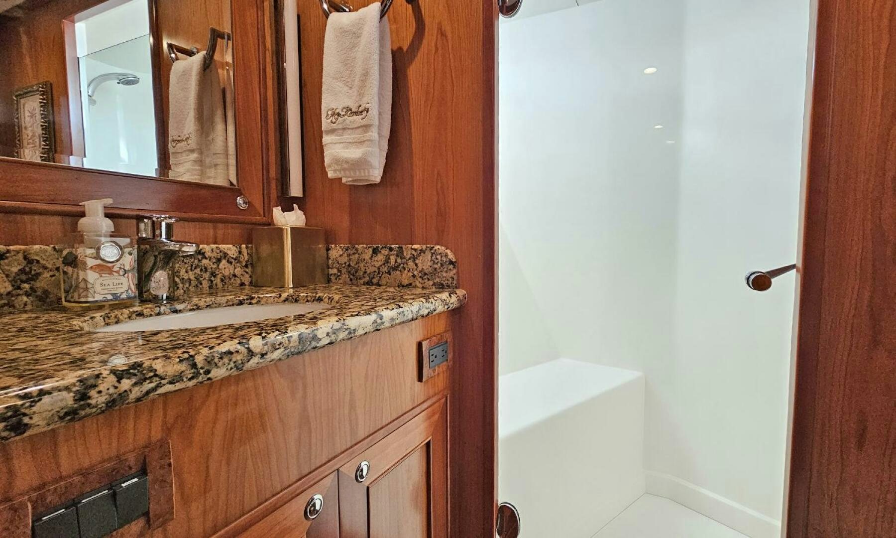 a bathroom with a countertop sink and mirror aboard MY KIMBERLY Yacht for Sale