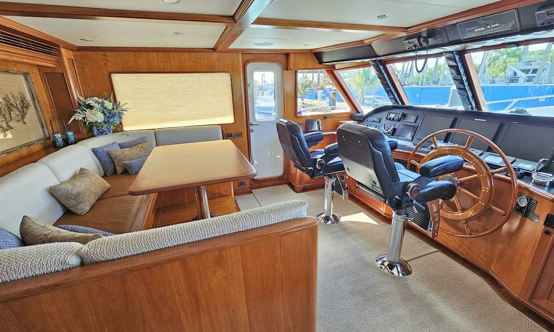 a room with a couch and a table and chairs aboard MY KIMBERLY Yacht for Sale
