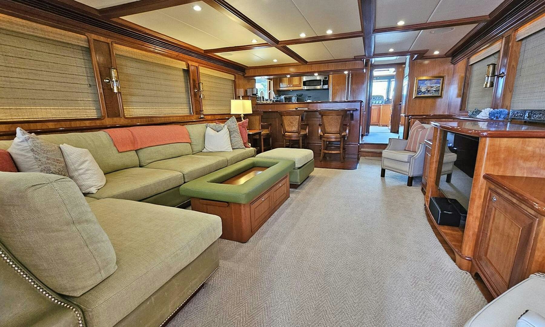 a living room with a couch and a table aboard MY KIMBERLY Yacht for Sale
