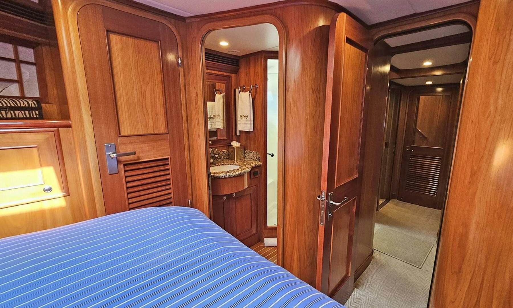 a bed in a room aboard MY KIMBERLY Yacht for Sale