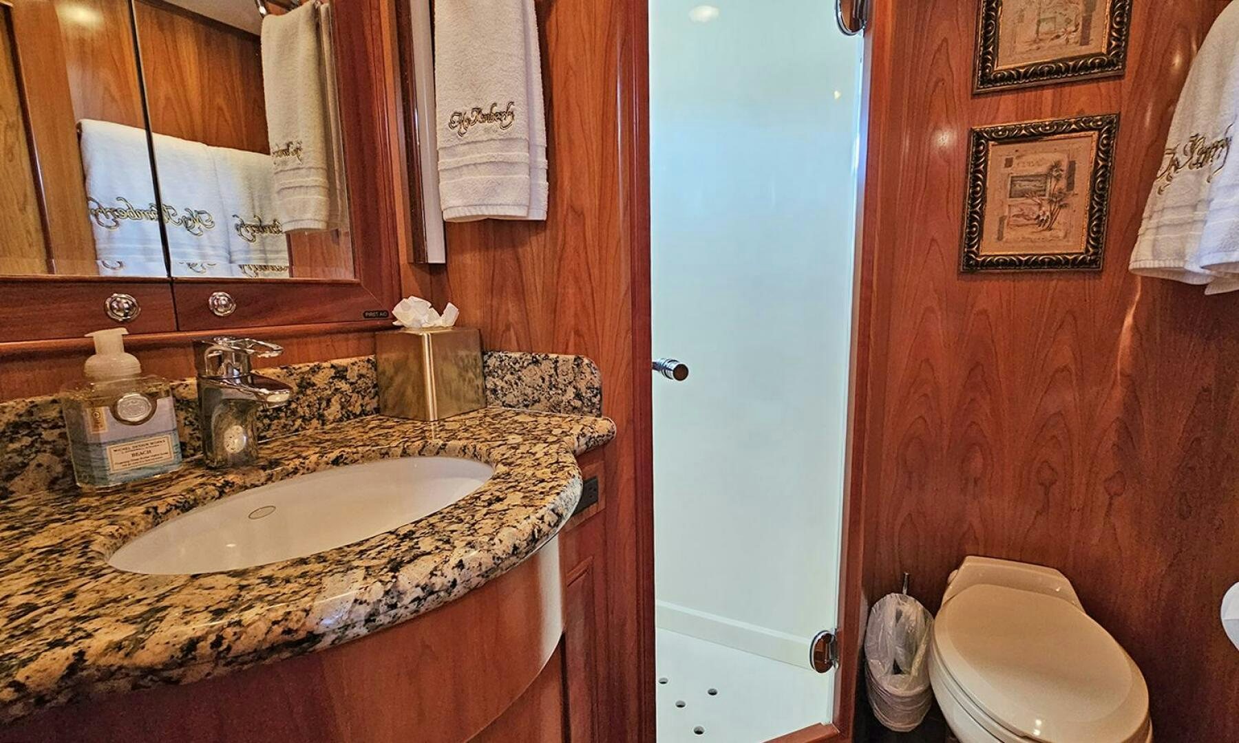 a bathroom with a sink and toilet aboard MY KIMBERLY Yacht for Sale