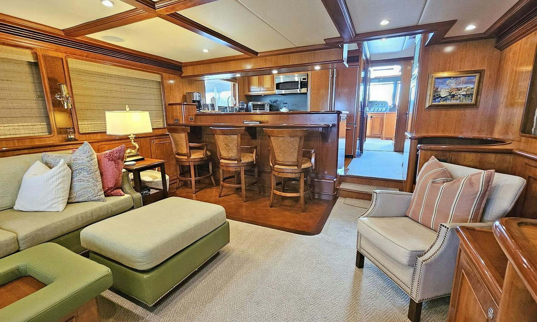 a living room with a couch and a table aboard MY KIMBERLY Yacht for Sale