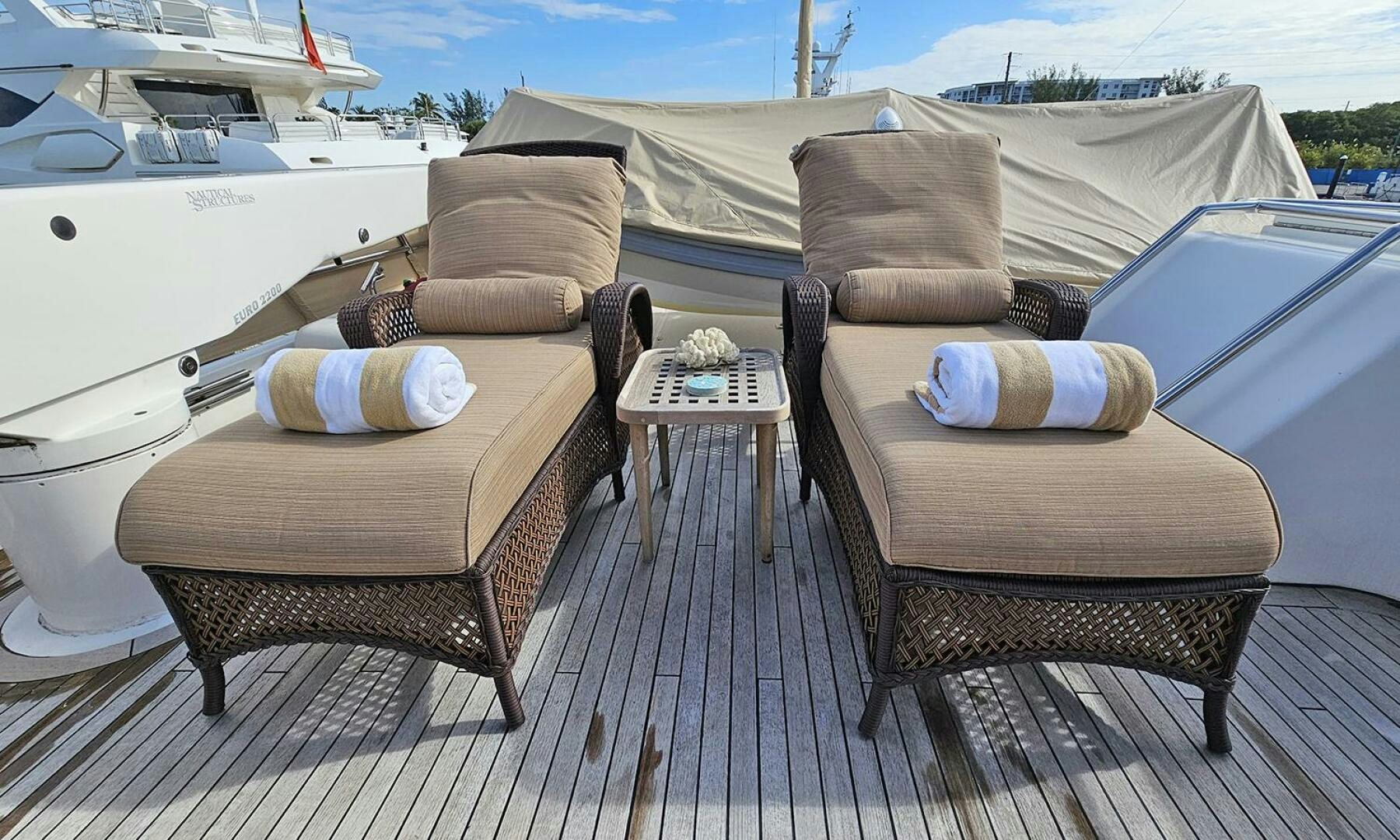 a couple of chairs on a deck aboard MY KIMBERLY Yacht for Sale