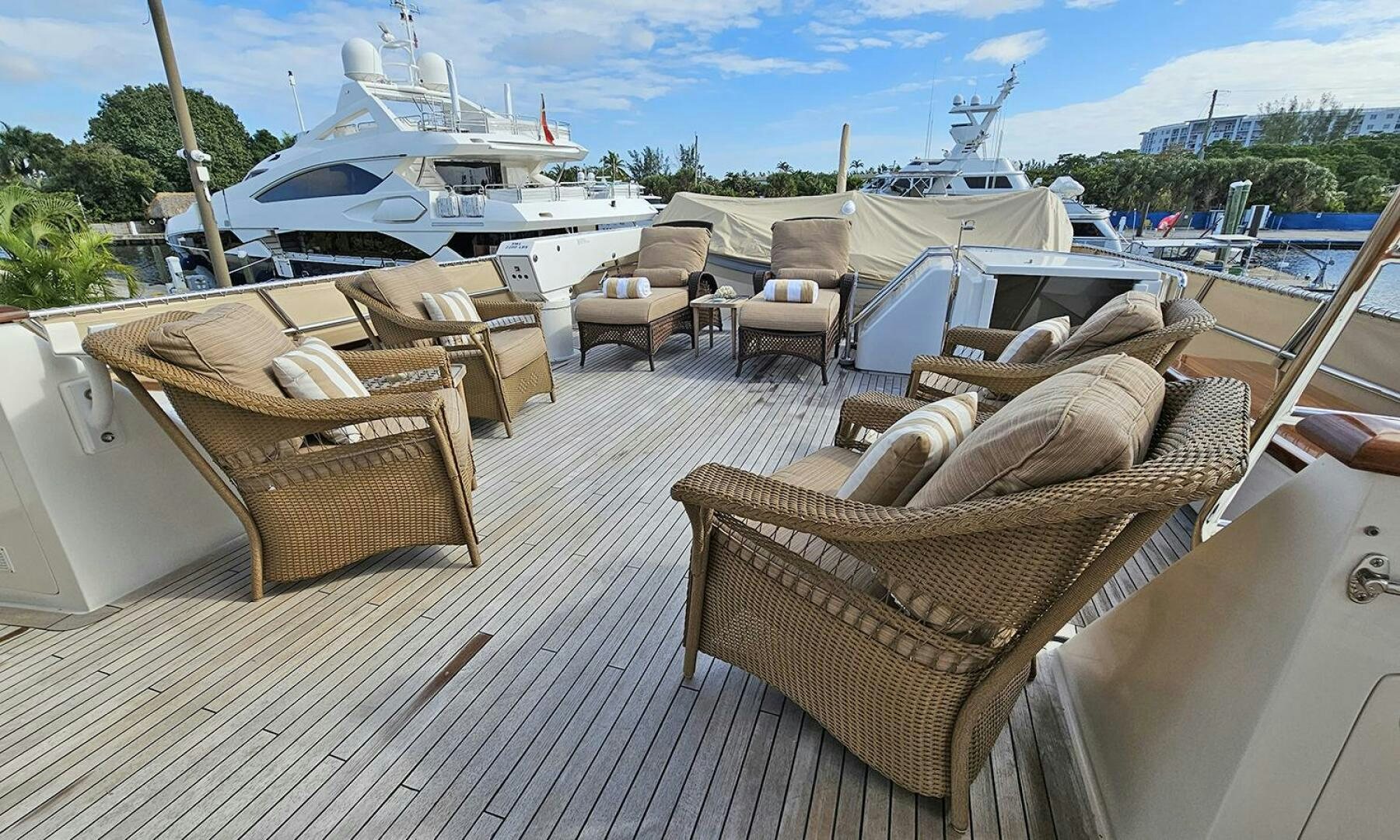 a group of chairs on a deck aboard MY KIMBERLY Yacht for Sale