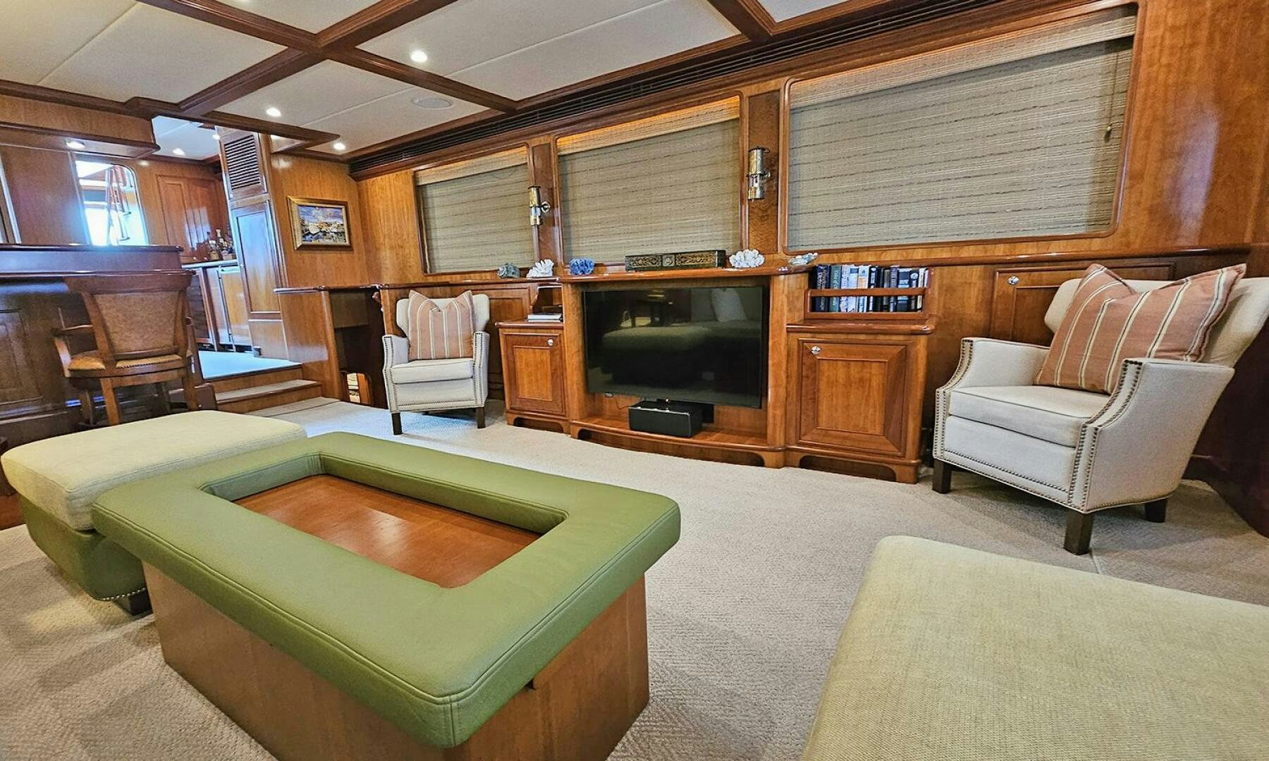 a living room with a couch and a television aboard MY KIMBERLY Yacht for Sale