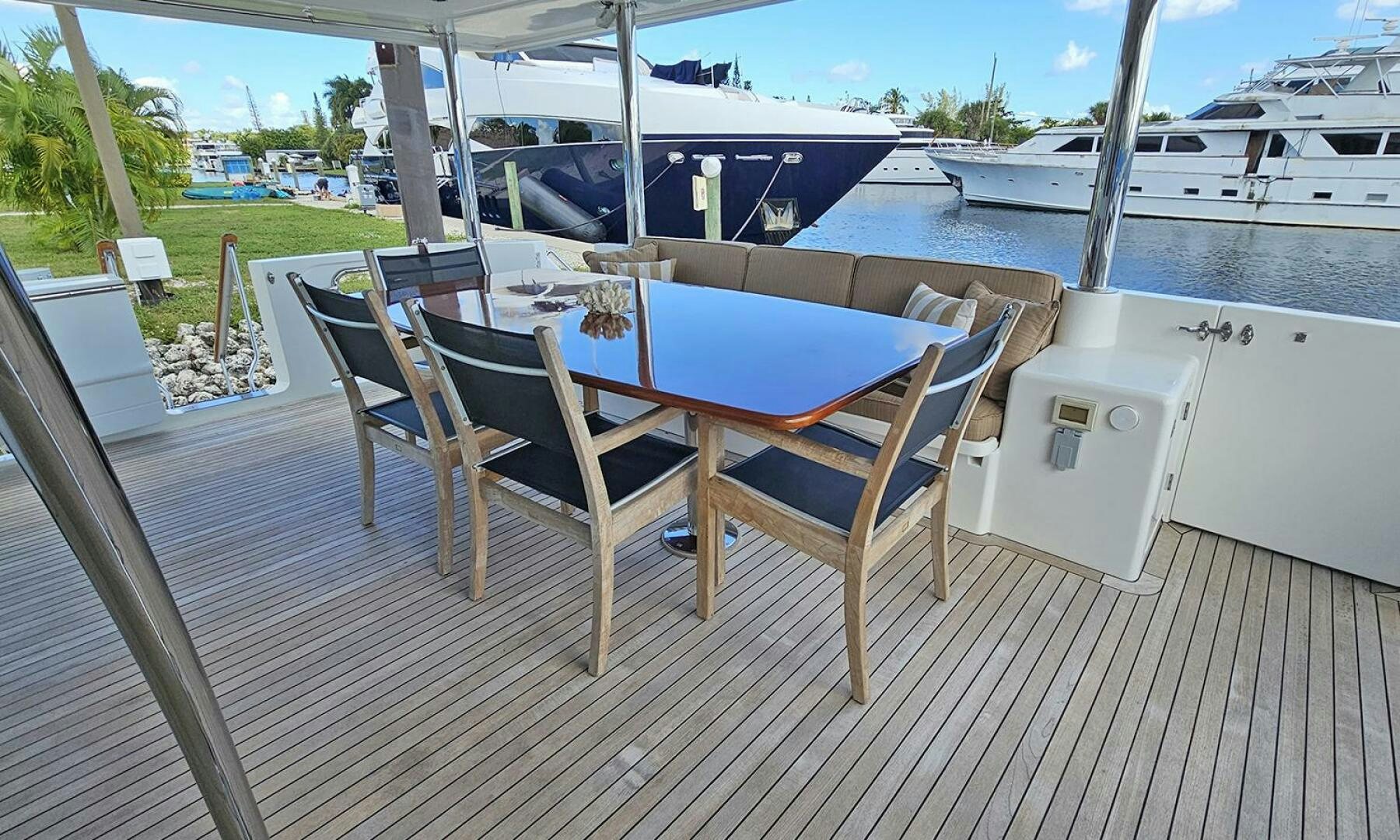 a group of chairs on a deck aboard MY KIMBERLY Yacht for Sale