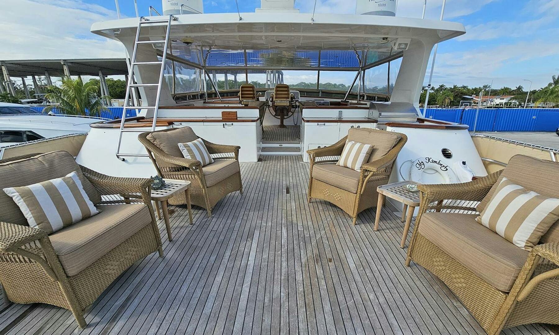 a deck with chairs and a pool aboard MY KIMBERLY Yacht for Sale