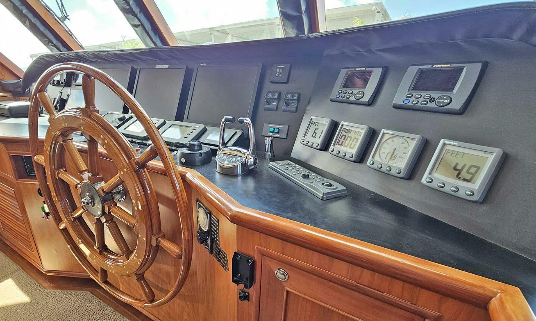 a wooden table with a large radio aboard MY KIMBERLY Yacht for Sale