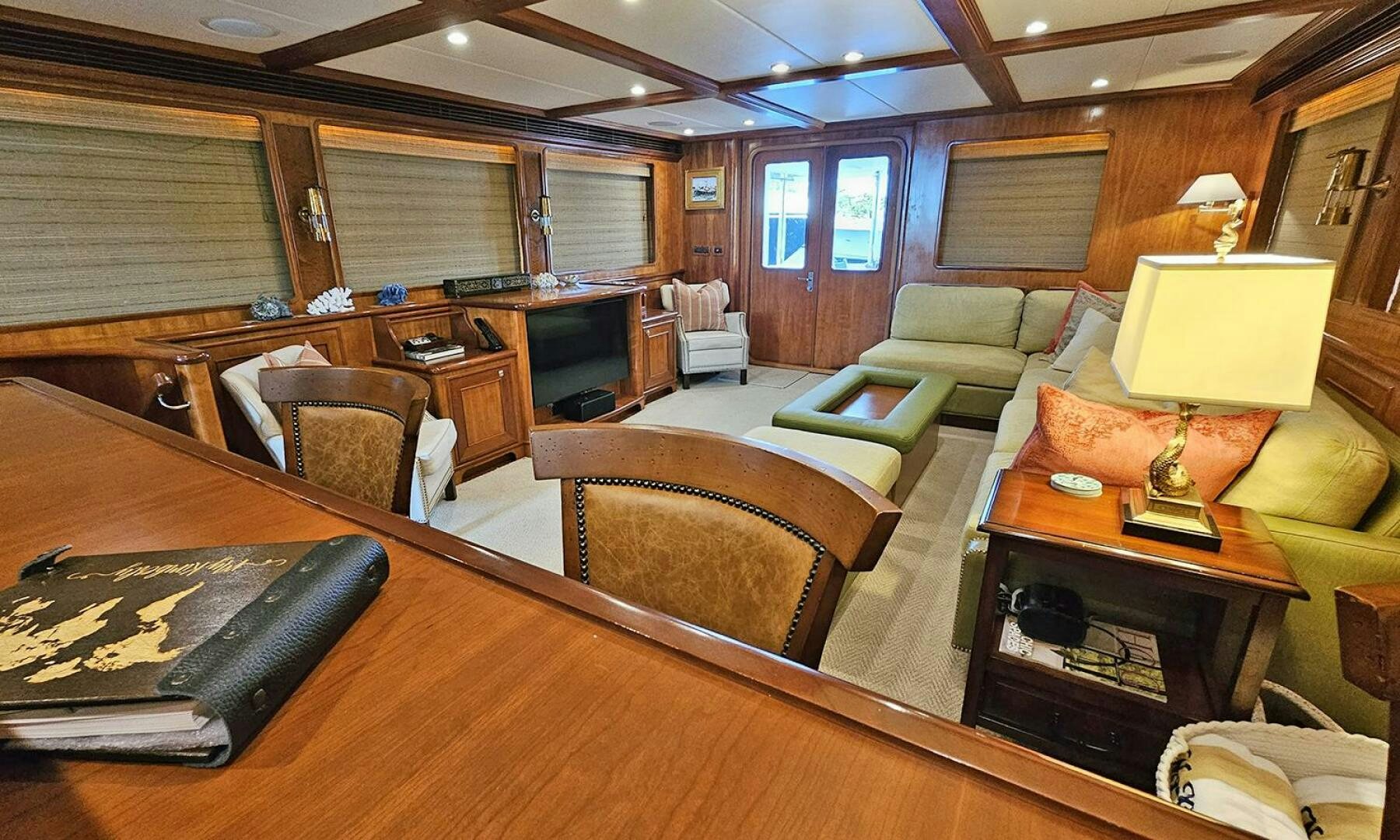 a living room with a couch and a table aboard MY KIMBERLY Yacht for Sale
