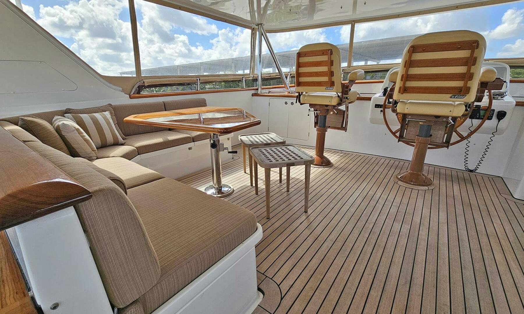 a boat with a table and chairs aboard MY KIMBERLY Yacht for Sale