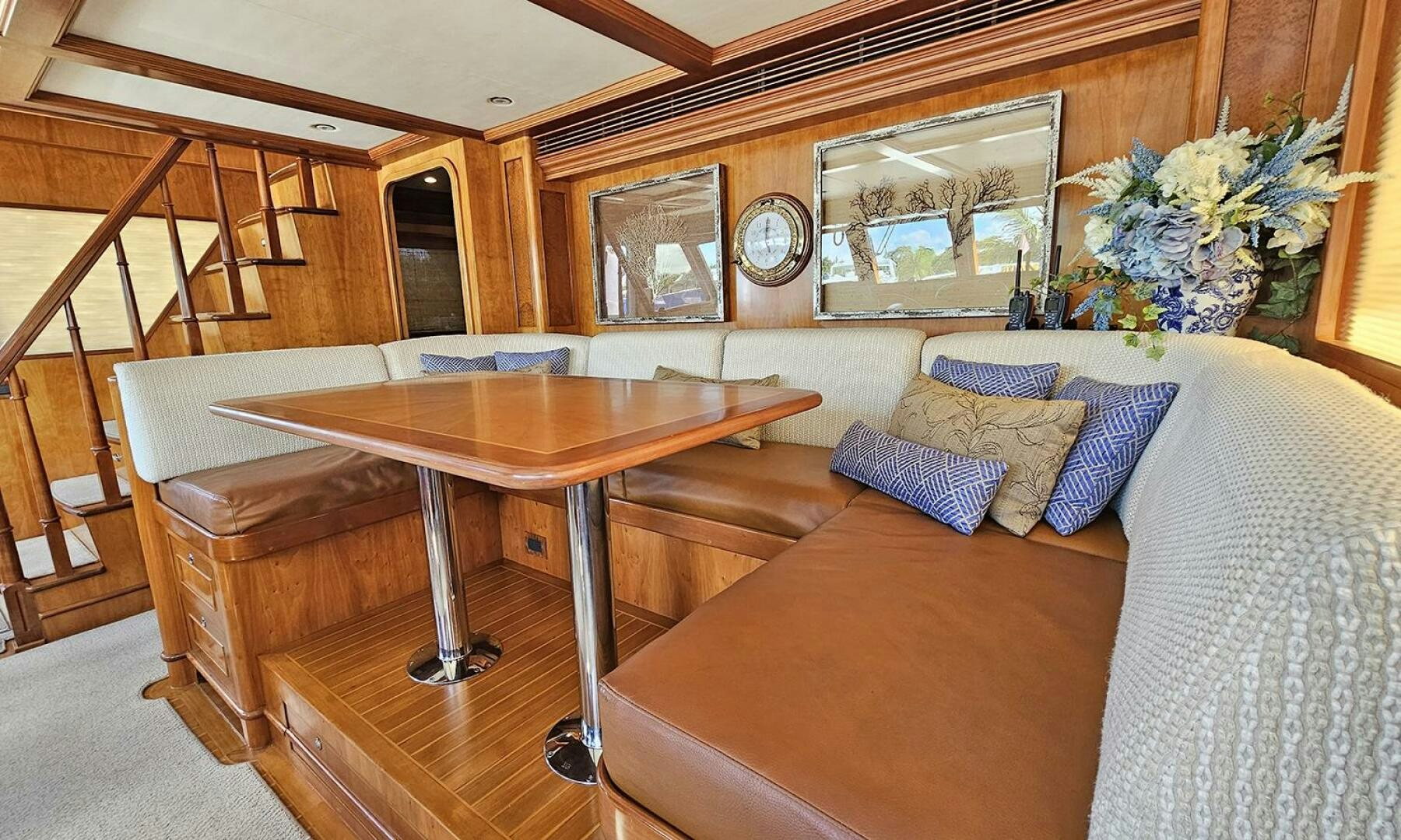 a living room with a couch and a coffee table aboard MY KIMBERLY Yacht for Sale