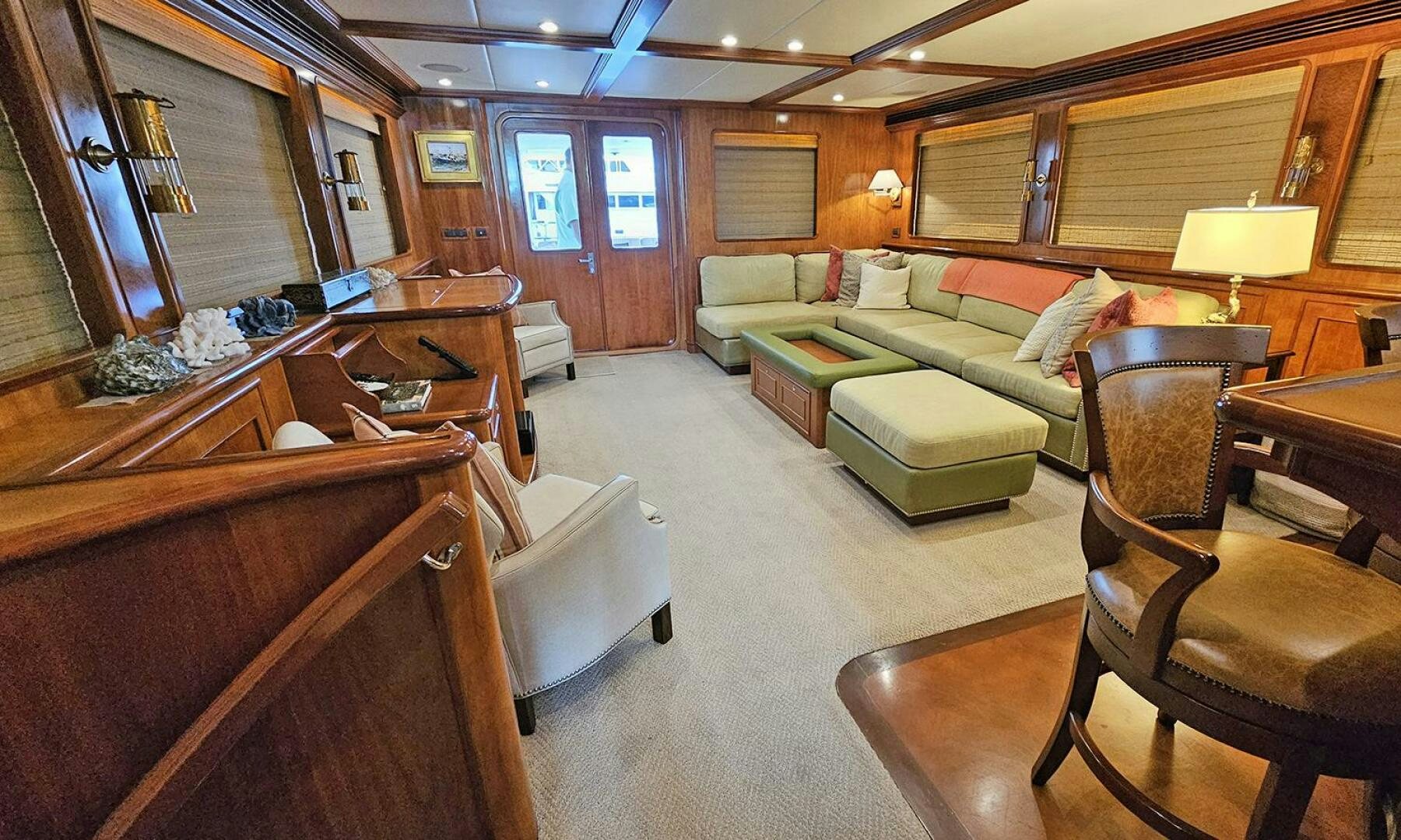 a living room with a couch and a piano aboard MY KIMBERLY Yacht for Sale